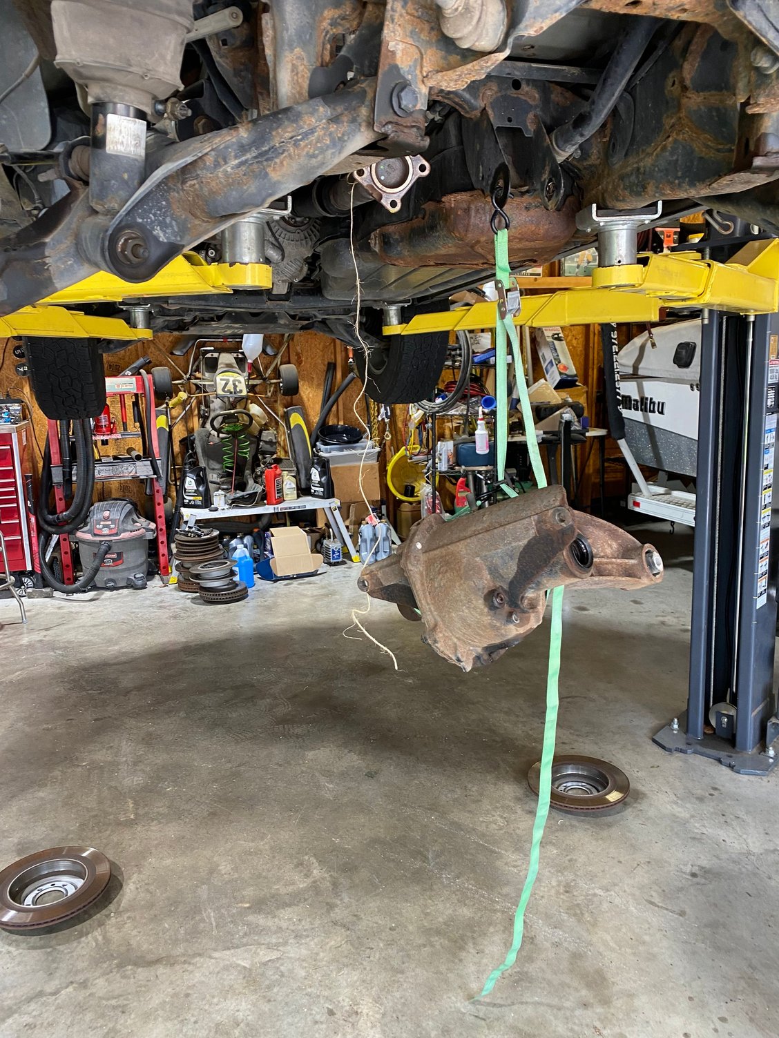 I hung the diff from the car, removed the trans jack, then lowed the car to set the diff on the ground.