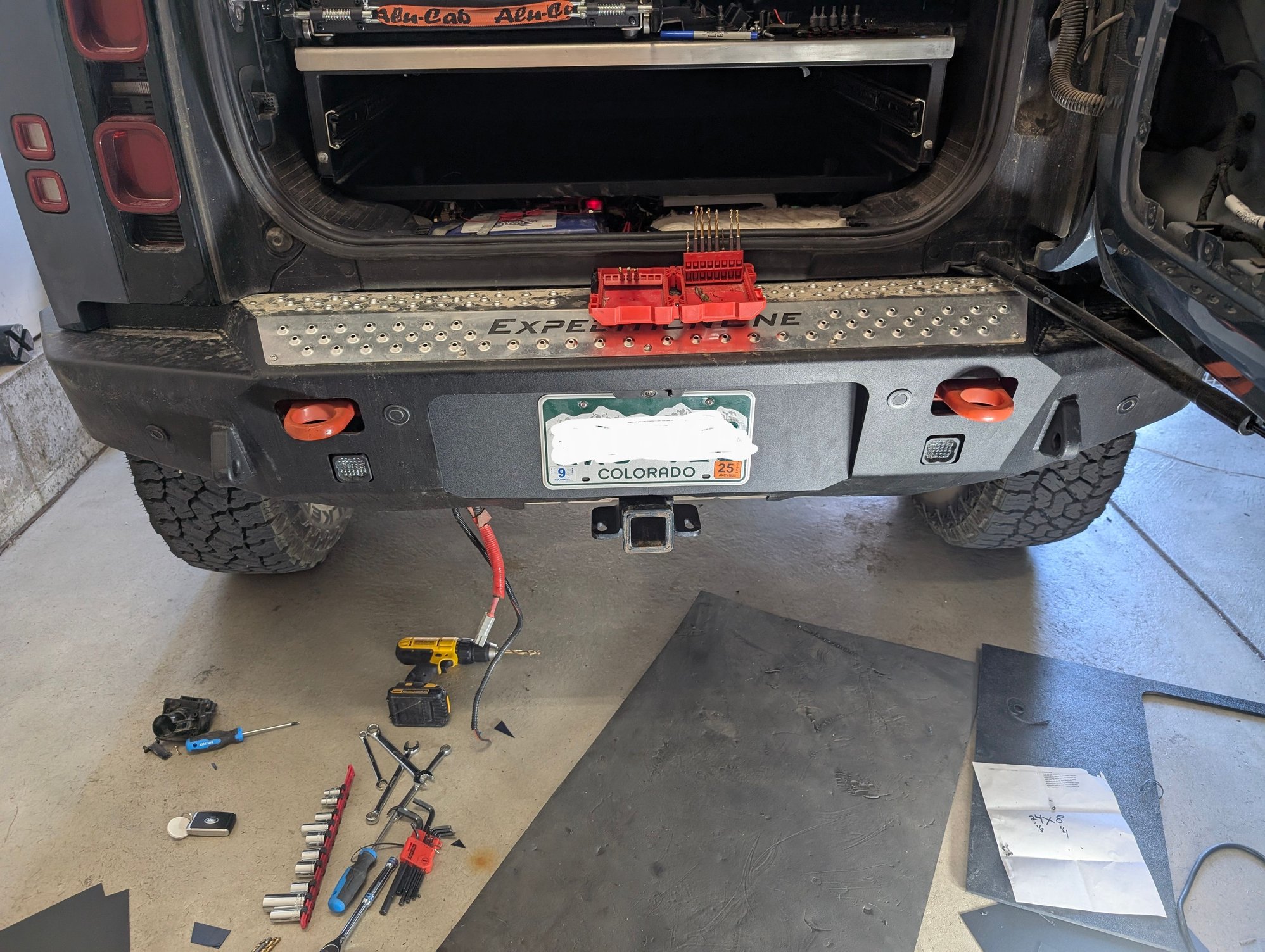 Shot showing me fixing my measuring mistake for the two holes. I think it looks pretty good. Doesn't even look like that is a 1mm piece of black plastic behind the license plate.