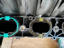 New gasket installed on the far left and the old ones still in. There is serious degradation of the old ones. 