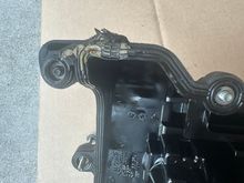 the original gasket sat flush at the screw holes but when installing the new gasket it bulges out at each screw hole because of the rubber washer behind it. 