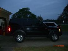 Sundown in background.  Lifted off-road ride height, sitting on those Fuzion XTi 285/60-18 tires and lifted with TODCO Adjustable Height Joining Rods set @ -8mm.  I love the way it rides and drives and can't yet determine if it's the tires or the lift causing the different feeling.