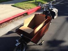 Heads to machine shop by dutch bakfiets