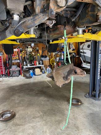 I hung the diff from the car, removed the trans jack, then lowed the car to set the diff on the ground.