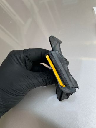 It has an adhesive strip which isn't totally needed but it helps hold it to the cowl while you install it. LH is marked LH and RH is marked RH btw underneath in the rubber. 