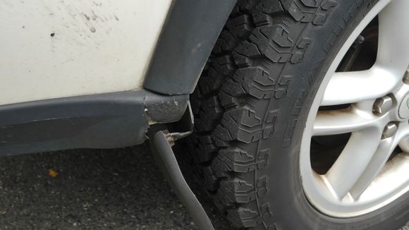 Rear passenger mud flap cracked