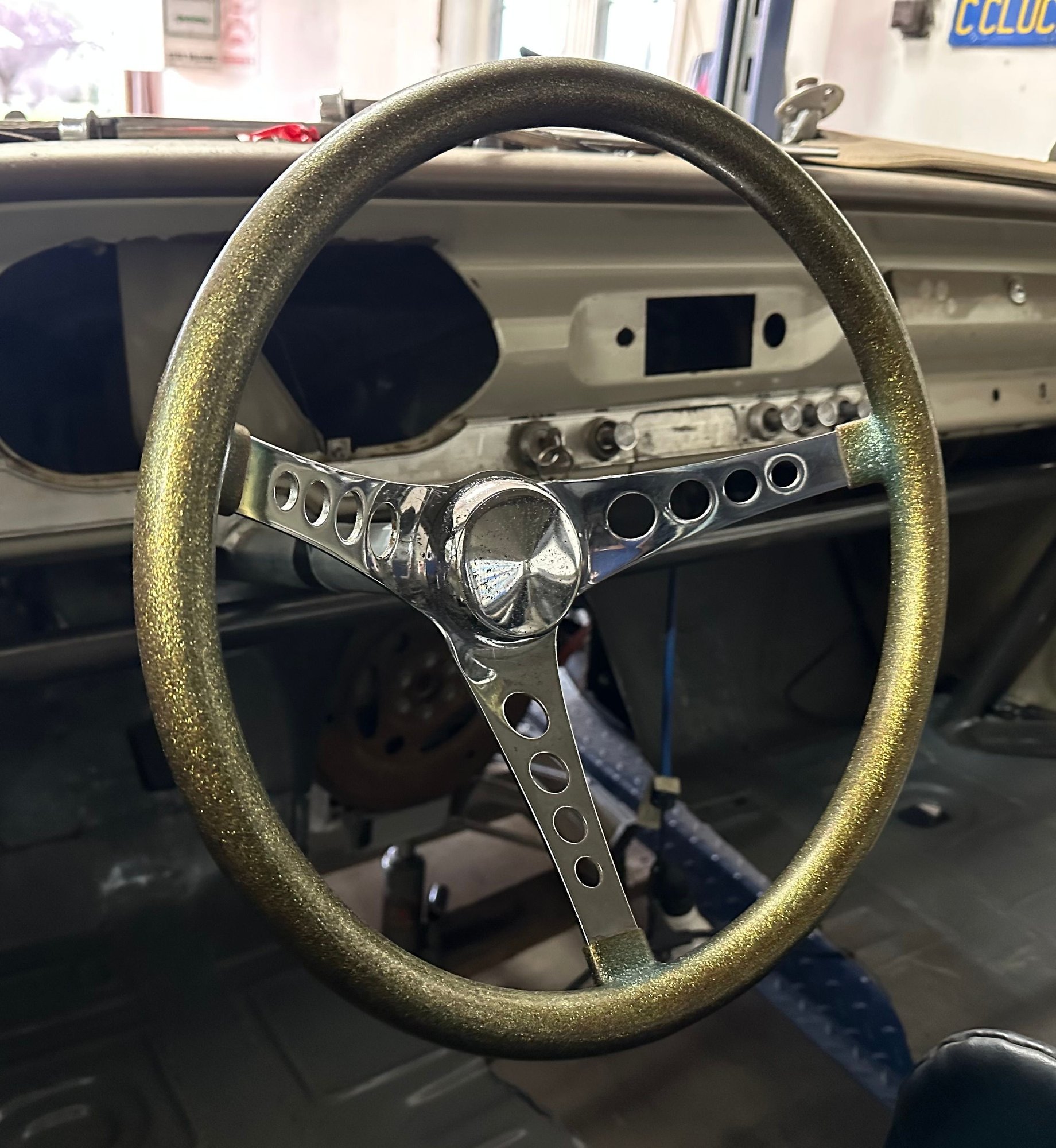 Picked up this vintage gold flake steering wheel. Fits the cars vibe perfect