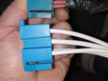 Top factoy pigtail, bottom new pigtail. Notice 2 pink wires on first terminal, new pigtail has only one and added a white wire to middle terminal 