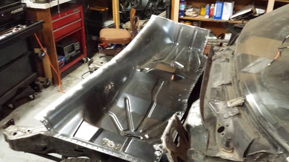 Prepping the floor pan to be installed.