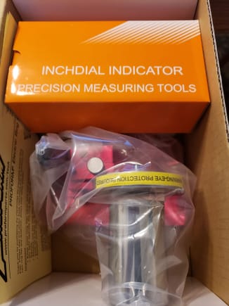 Dial indicator, heavy weight anodized platform, cutting/grinder wheels and charger. It is a battery operated tool  and does not have to be plugged in.