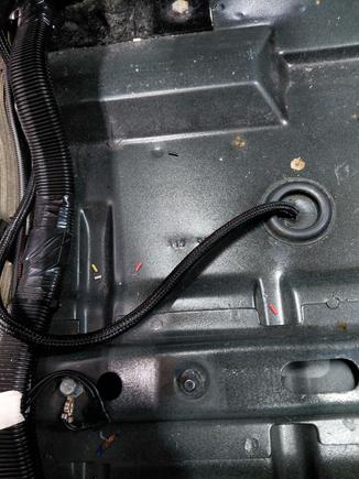 Found a grommet in the floor right under the driver seat that made perfect access for the FF sensor harness.