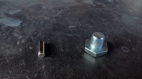 Differential Drain Plug - The drainplug for the MWC 9" is just a shorty bolt. I bought this powerful neodymium magnet to attach to it for the inevitable metallic filings. Note that end magnet and bolt are already pre-scuffed in this pic.
