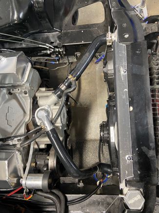 Took some scrap aluminum from the cold aro cowl and made it into a top mounting bracket for the fan shroud.