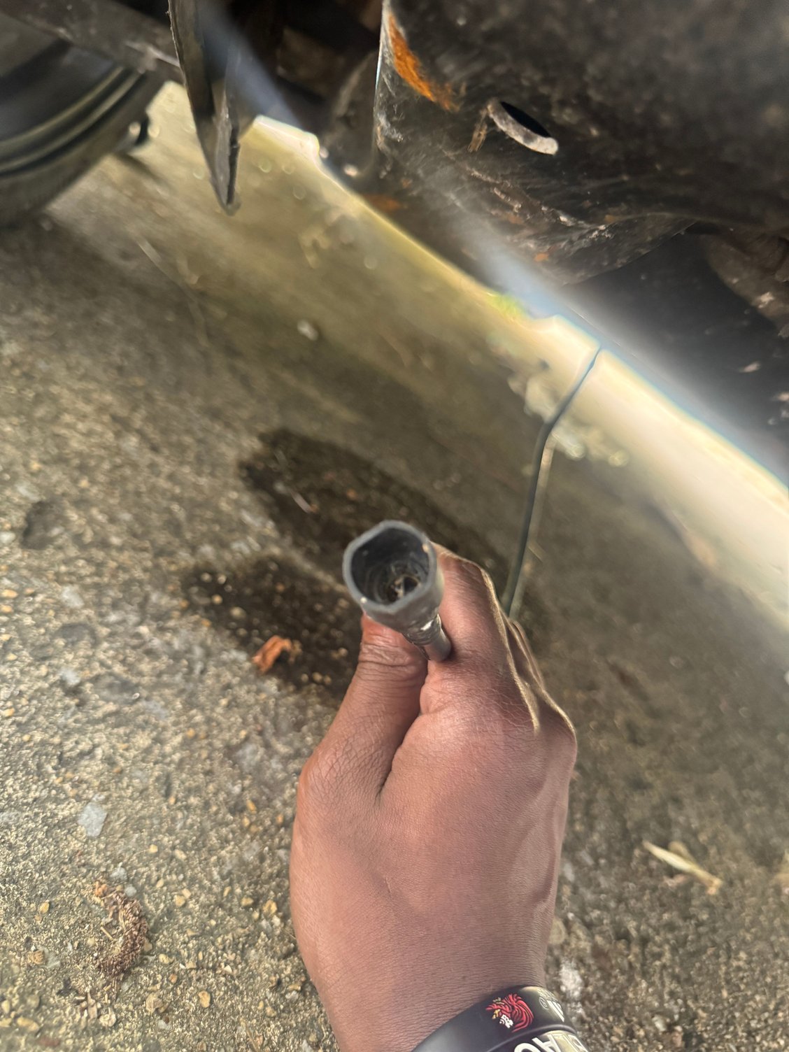 the cable is coming from right behind oil pan i think