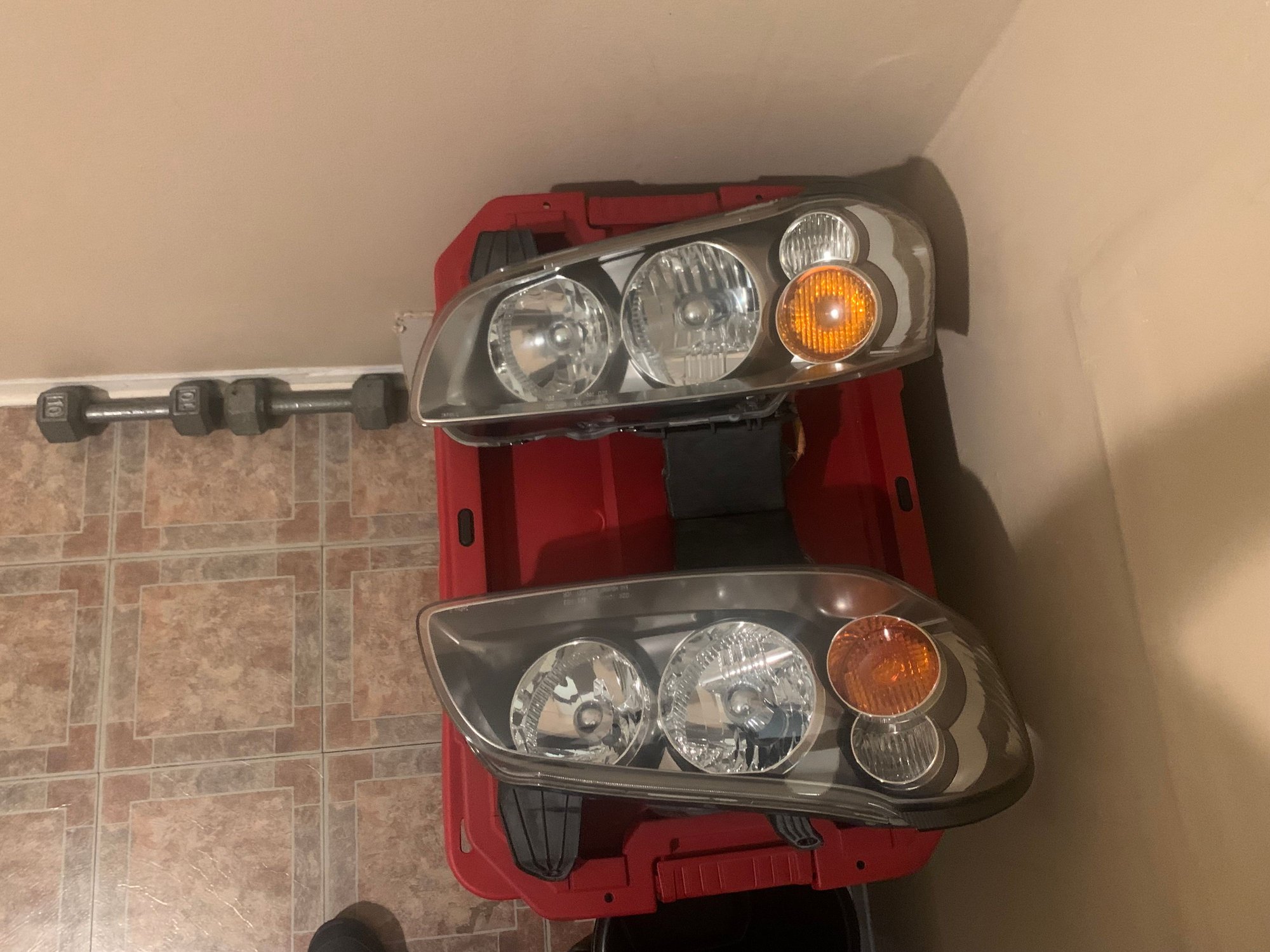 Here�s the same headlights after clear coating them�