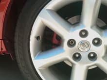 Closer view of rear caliper with tire on