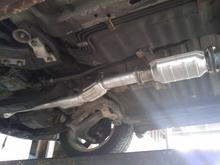 Got it all installed without loosening the precat. The damn thing was rusted on too tight.  Thanks mechanical advantage. Car sounds great now.