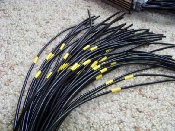 Each wire has a label. Each label is formated as follows:

connector letter-pin number (wire number)