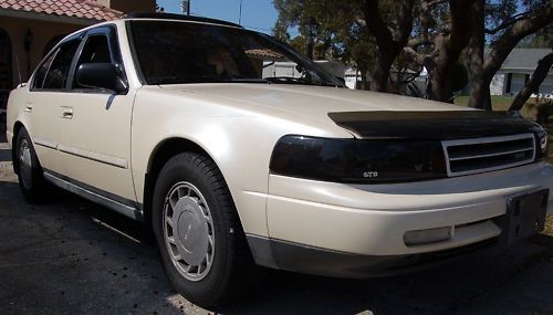 90 Maxima SE with headlight covers.