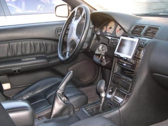Kenwood screen with touch screen in stock location with carbon fibre dash kit.
