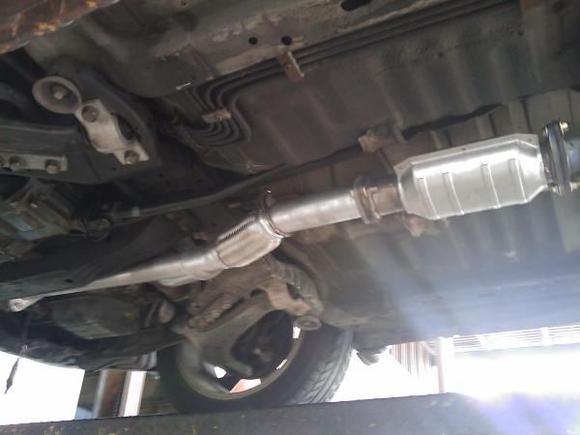 Got it all installed without loosening the precat. The damn thing was rusted on too tight.  Thanks mechanical advantage. Car sounds great now.