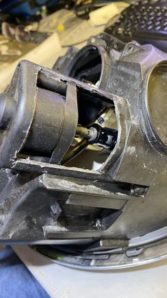 Cut out this part of the headlight.
MAKE sure not to cut too deep at the top where the motor is located