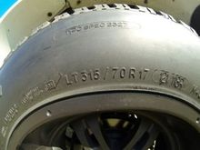 BFGoodrich 315/70R17.  Same tire used on the H2 Hummer.  The significant change in tire size is compensated with an on-board switch to properly calibrate the speedometer.