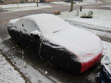 The Bud Chevy of Juniorcar under the car cover with snow on it.