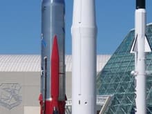 Three big missiles on display near the museum entrance.