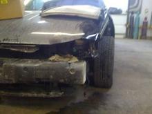 at the body shop tore down a bit to evaluate the damages.
they used my smashed hood to store a smashed rad from a truck...