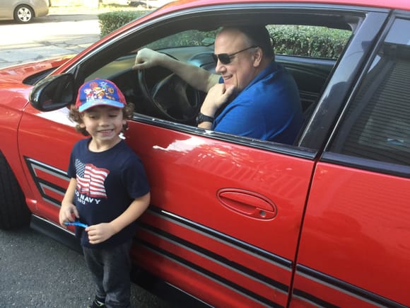 My brother in his ‘04 SS Dale Jr car and my son Giovanni.   My kids love his victory red Monte!