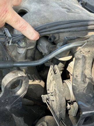 I don’t know the correct terminology, but it comes off the top of the motor for a racing addition to the motor. 
