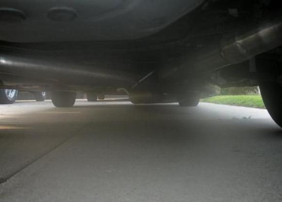 the pics are bad sorry, it looks like the muffler is close to the ground but it have around 6"-8" clearance