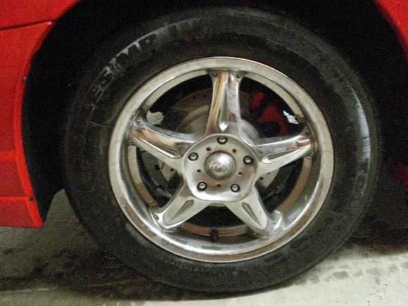 New PR drilled/slotter rotor with ceramic pads, painted caliper also.