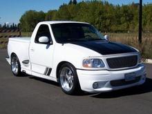 Daily driver, 2002 Ford Lightning, 418RWHP/541TQ
12.70s@106MPH, and it will still get 17.5MPG.
Not bad for a Ford