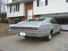 The Governor's license plate had arrived. 
In West Virginia, plate numbers 1 through 2000 are reserved for the Governor. If you want one, you have to convince the Governor that your car should wear it. He agreed that 1966 should be on this Charger.