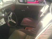 IMAG0645bucket seats in a beige cloth and a custom rear bench in the rear where there used to be a shelf and no seat ,the business coupes did not come with one,,works out nice for the grandkids,can fir three in the rear,,has a tilt wheel and steering column out of a trans am,, and a great heater for cool fall nights,,and a high output stereo with a great CD changer,it rocks pretty good with some old 50"s music