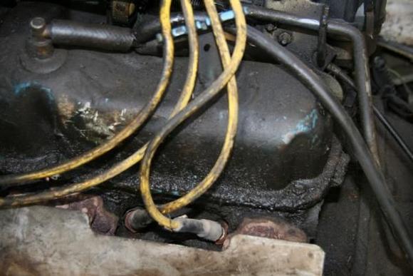 very dirty oil dust mixture covers the engine