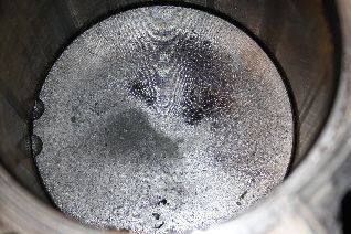 Flat piston, notches toward the front. Was about 1/4 inch from the top deck when TDC. Low Compression, these gotta go.