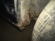 This is rust at the rear of the drivers inner rocker panel.  This may indicate that the entire inner rocker, critical to the 65 convertible, needs to be replaced.