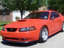 My second mustang; 2004 Competition Orange GT 5-speed manual!!! Miss that car!!