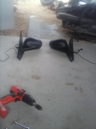 Mustang puddle lights installed in side mirrors. Long wires go to light and short wires are factory mirror adjustment