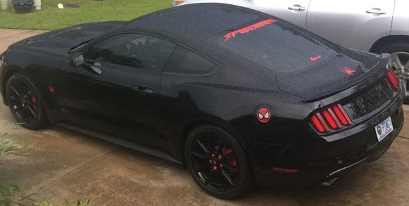 Man a black car looks so good in a rain storm