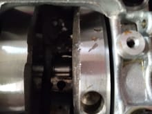 It may be hard to see, but #1 rod has exploded the big end, with part of the rod cap being stuck between the crank journal and the block. Catastrophic failures on #1 and #4 cylinders.