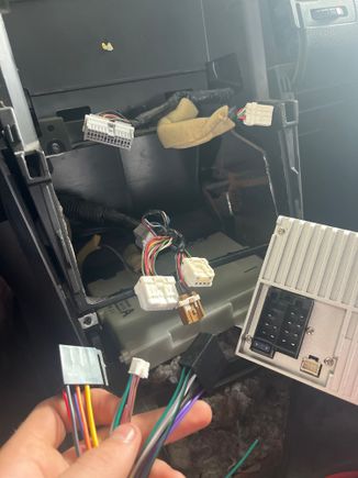 HELP!! I bought a PLZ double din radio for my 2003 350z touring. I took out the old unit to put the new one but the plugs don’t match the one in the new unit. They gave me adapters but they don’t match the colors in the car. I’m new the wiring and don’t know anything about it. What do I do??