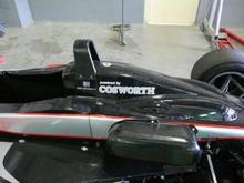 cosworth powered single seater inside the workshop at ascari