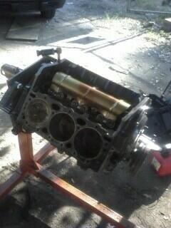 Junkyard motor torn down in progress.