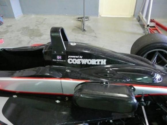 cosworth powered single seater inside the workshop at ascari