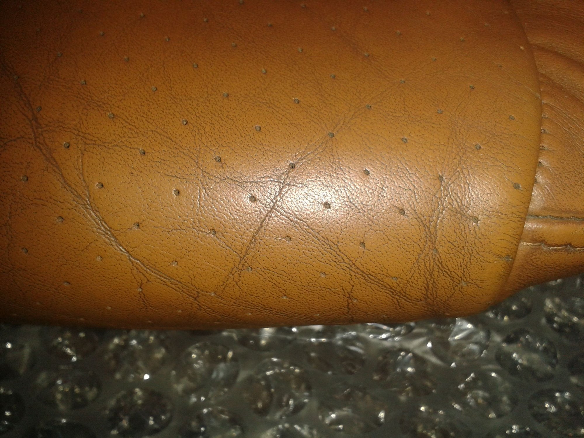 Is this an original Porsche part (natural brown leather seat