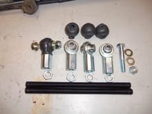 Painted threaded rod, rod ends, boots, and upper mounting hardware. Note one rod end and boot are mocked up.