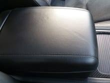 Only real flaw on the interior is this scratch in the  arm rest.